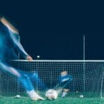 timelapse photo of soccer player kicking ball